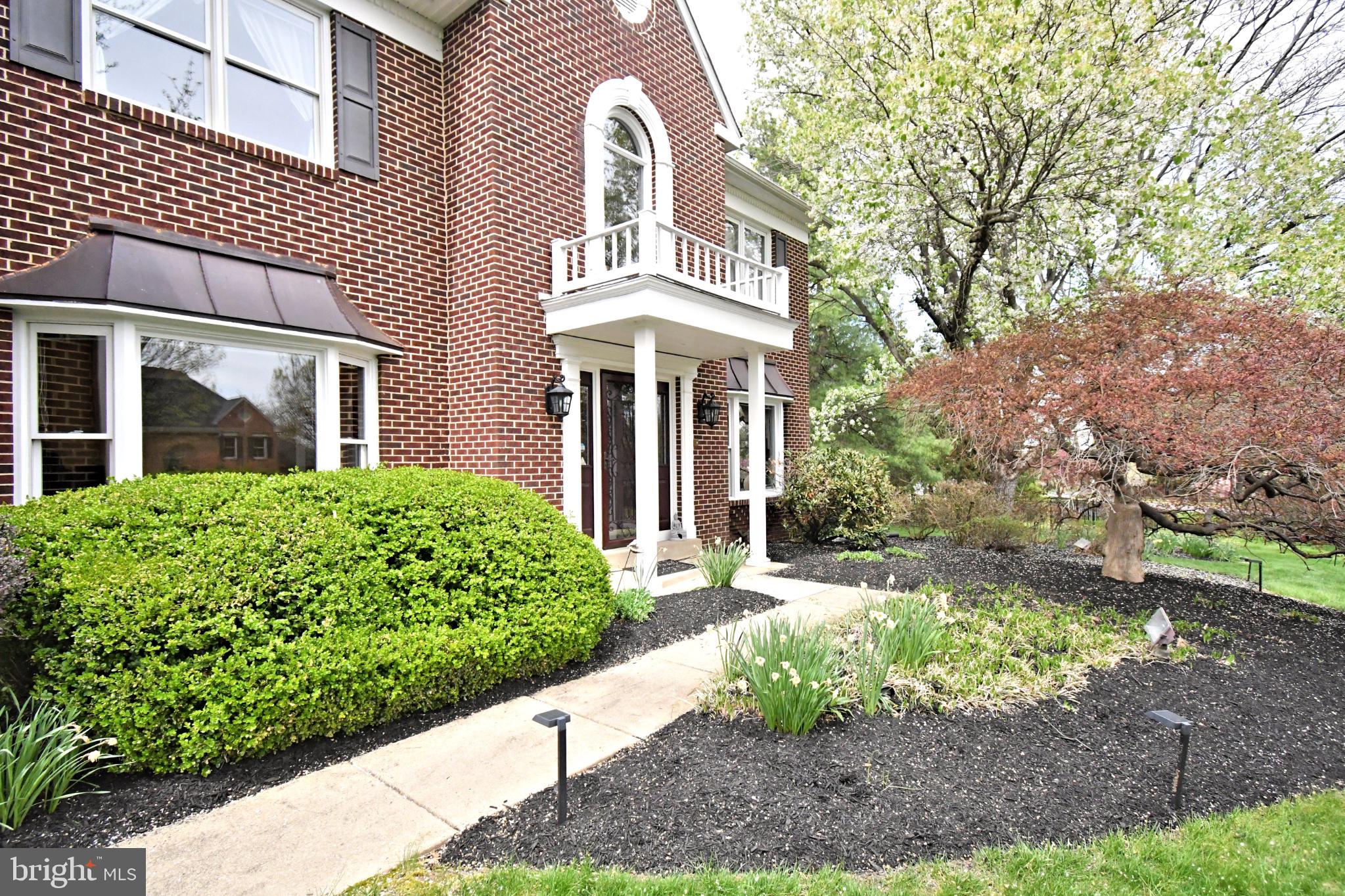 112 South Mennonite Road Collegeville, PA 19426 - Photo 5 of 131 Charming brick facade with lush landscaping.