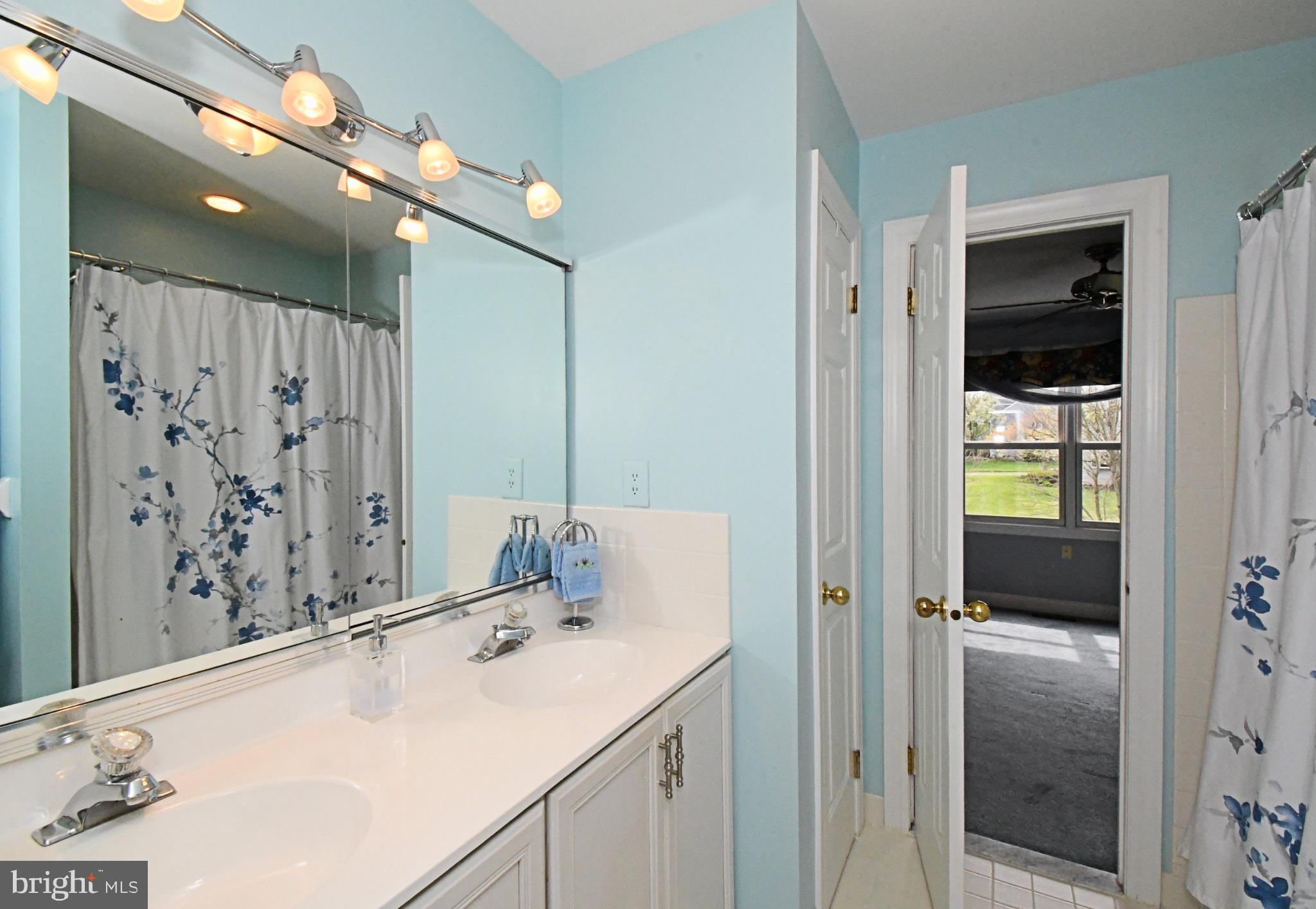 112 South Mennonite Road Collegeville, PA 19426 - Photo 80 of 131 Serene bathroom with floral accents.
