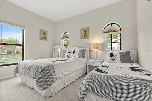 a bedroom with a bed and white walls