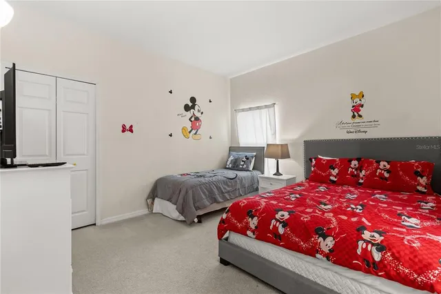 a bedroom with a bed and a dresser