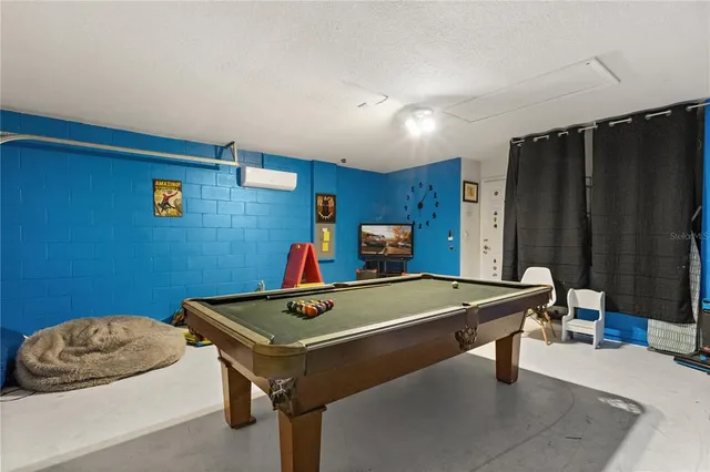a room with furniture and air hockey table