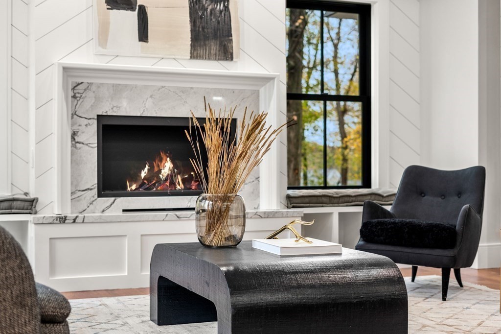 300 Elliot Street, Unit 2 Newton, MA 02464 - Photo 6 of 16 a living room with furniture a fireplace and a table