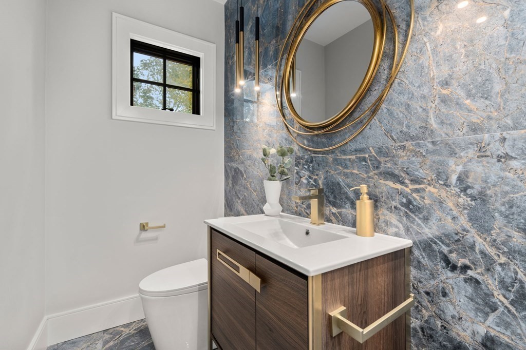300 Elliot Street, Unit 2 Newton, MA 02464 - Photo 8 of 16 a bathroom with a sink and a mirror
