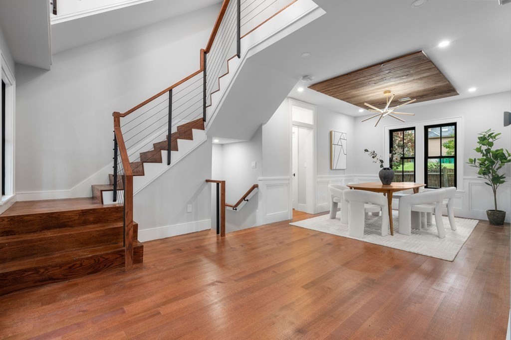 300 Elliot Street, Unit 2 Newton, MA 02464 - Photo 9 of 16 a view of entryway and hall with wooden floor