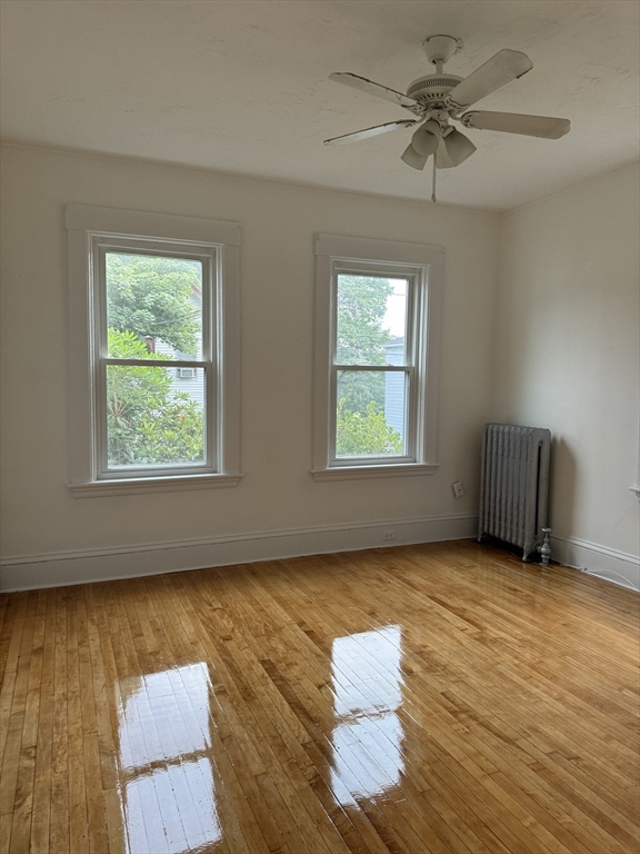 20 Temple Street, Unit 1 Fitchburg, MA 01420 - Photo 11 of 14 a view of an empty room window and wooden floor