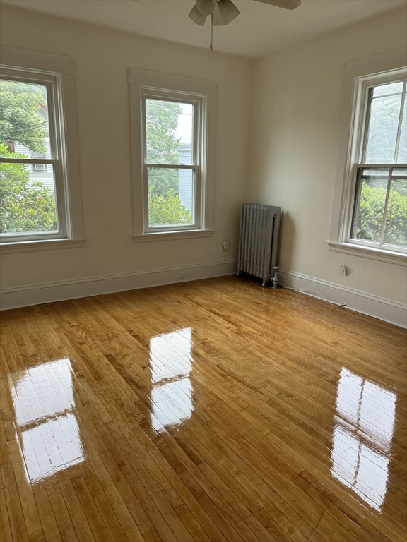 20 Temple Street, Unit 1 Fitchburg, MA 01420 - Photo 12 of 14 a view of an empty room with wooden floor and a window