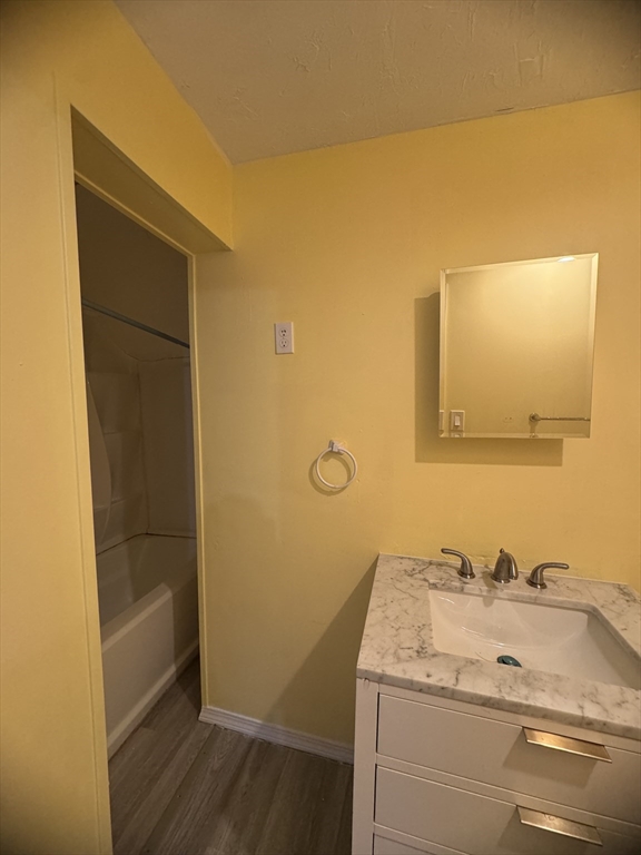 20 Temple Street, Unit 1 Fitchburg, MA 01420 - Photo 13 of 14 a bathroom with a sink and a mirror