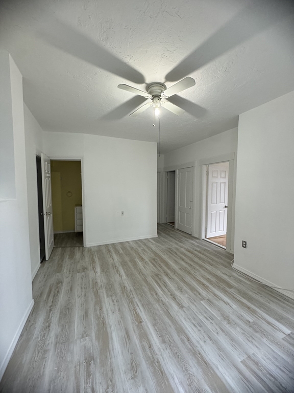 20 Temple Street, Unit 1 Fitchburg, MA 01420 - Photo 4 of 14 a view of empty room with wooden floor