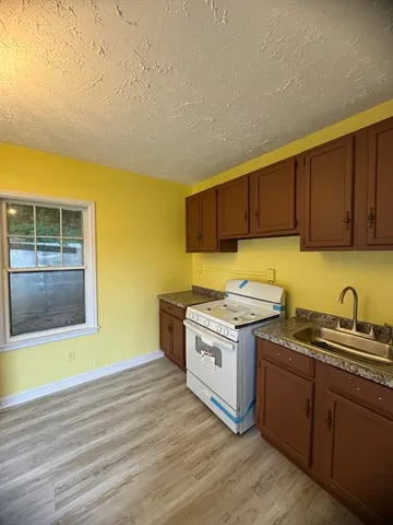 a kitchen with a stove and a sink