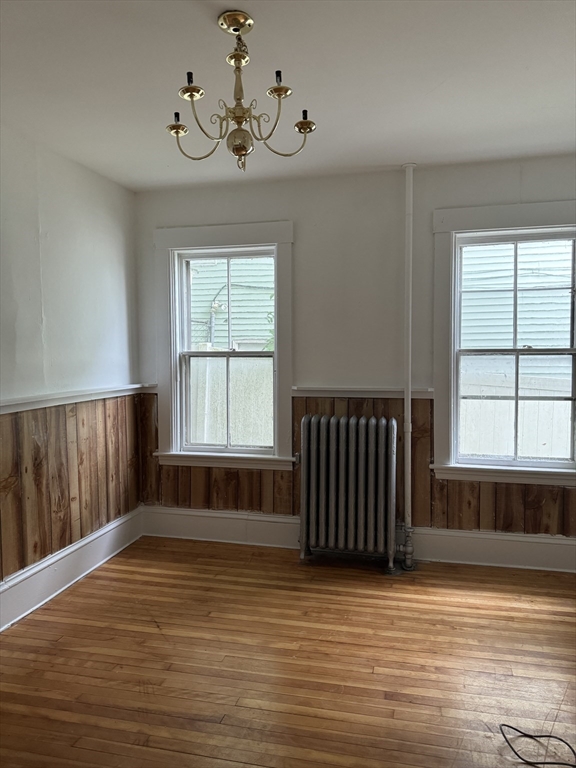 20 Temple Street, Unit 1 Fitchburg, MA 01420 - Photo 10 of 14 a view of an empty room with wooden floor and a window