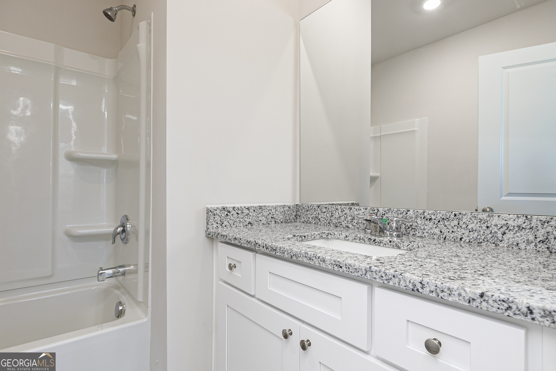 239 Rooker Drive LaGrange, GA 30241 - Photo 11 of 11 a bathroom with a granite countertop sink and a mirror