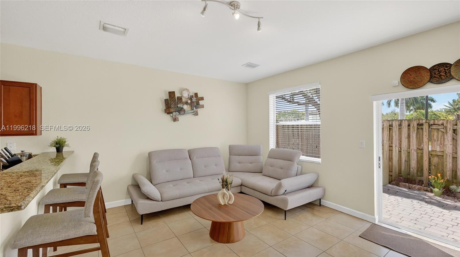 9041 Southwest 227th Street, Unit 5 Cutler Bay, FL 33190 - Photo 14 of 41 a living room with furniture and wooden floor