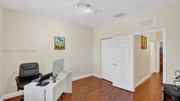 a view of workspace with wooden floor