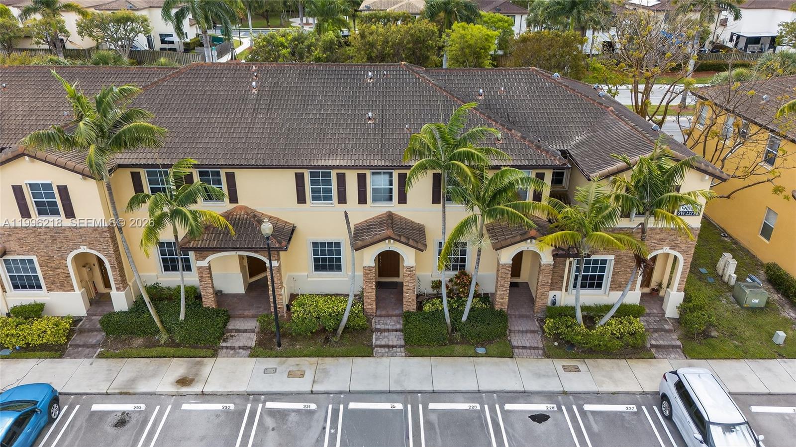 9041 Southwest 227th Street, Unit 5 Cutler Bay, FL 33190 - Photo 2 of 41 front view of a house with a garden