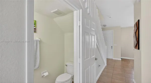 a bathroom with a shower and a toilet
