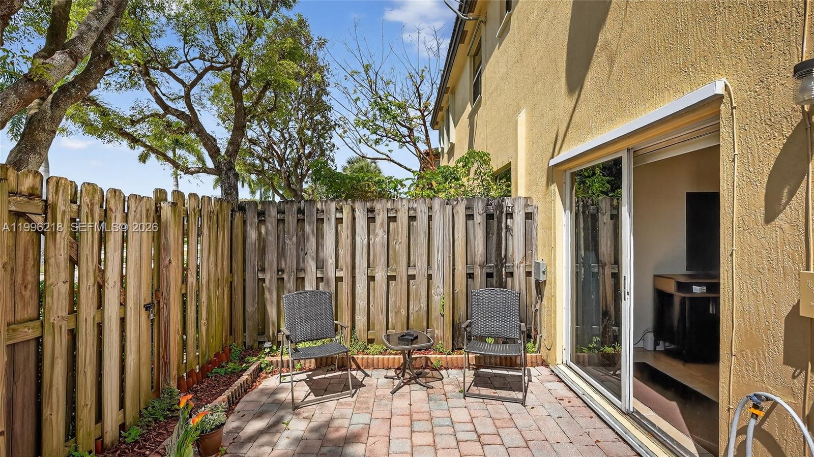 9041 Southwest 227th Street, Unit 5 Cutler Bay, FL 33190 - Photo 27 of 41 a view of outdoor space with seating area