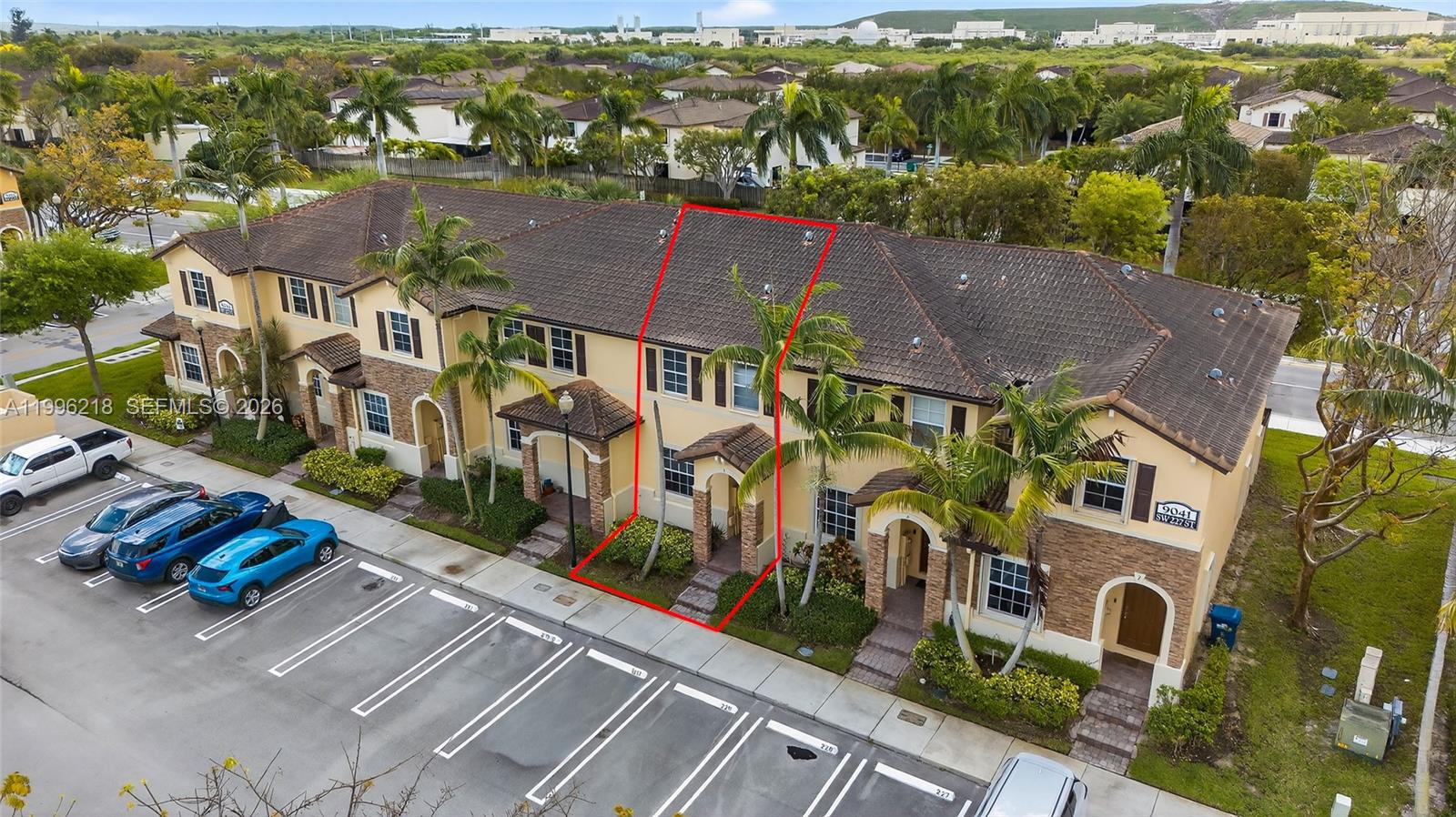 9041 Southwest 227th Street, Unit 5 Cutler Bay, FL 33190 - Photo 31 of 41 an aerial view of residential houses with outdoor space