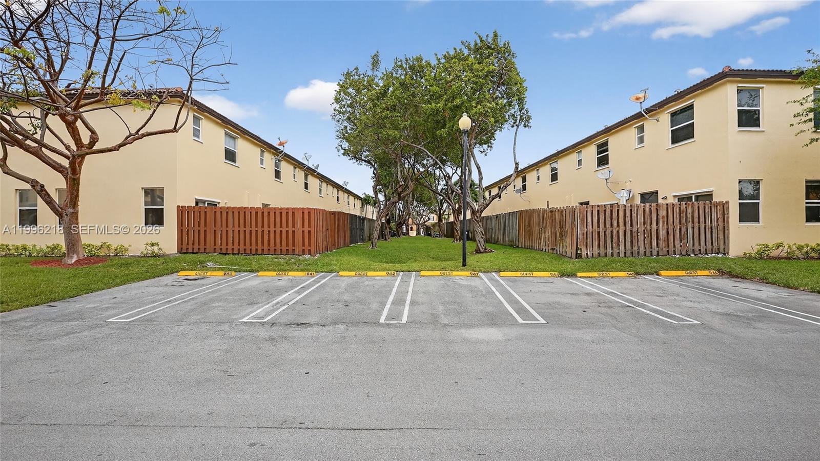9041 Southwest 227th Street, Unit 5 Cutler Bay, FL 33190 - Photo 35 of 41 a view of backyard with a garden and entertaining space