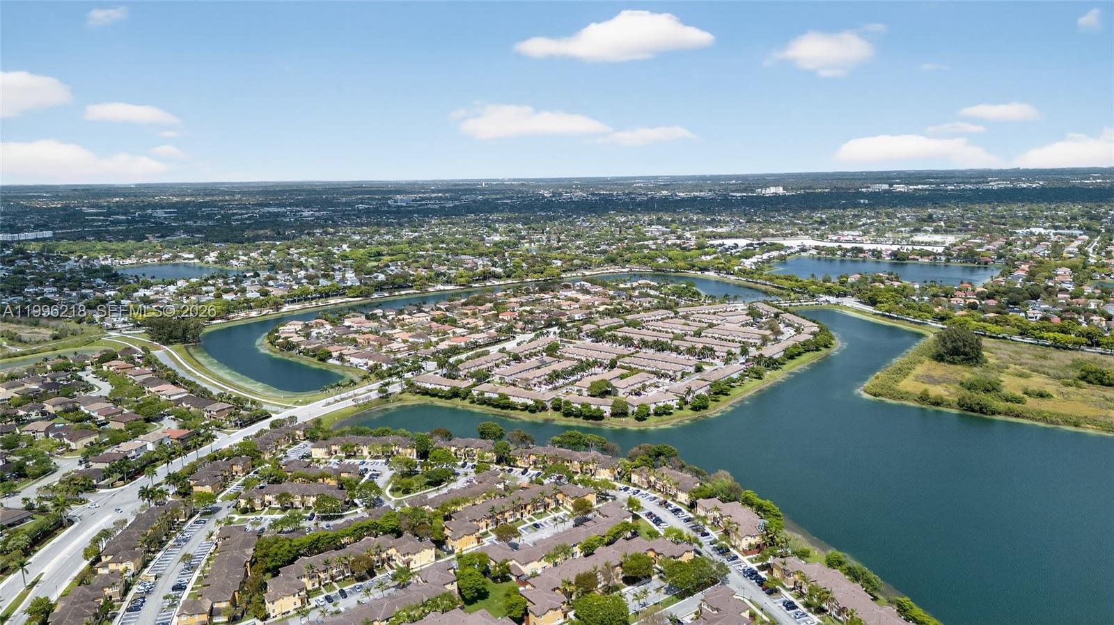 9041 Southwest 227th Street, Unit 5 Cutler Bay, FL 33190 - Photo 37 of 41 an aerial view of a house with a lake view