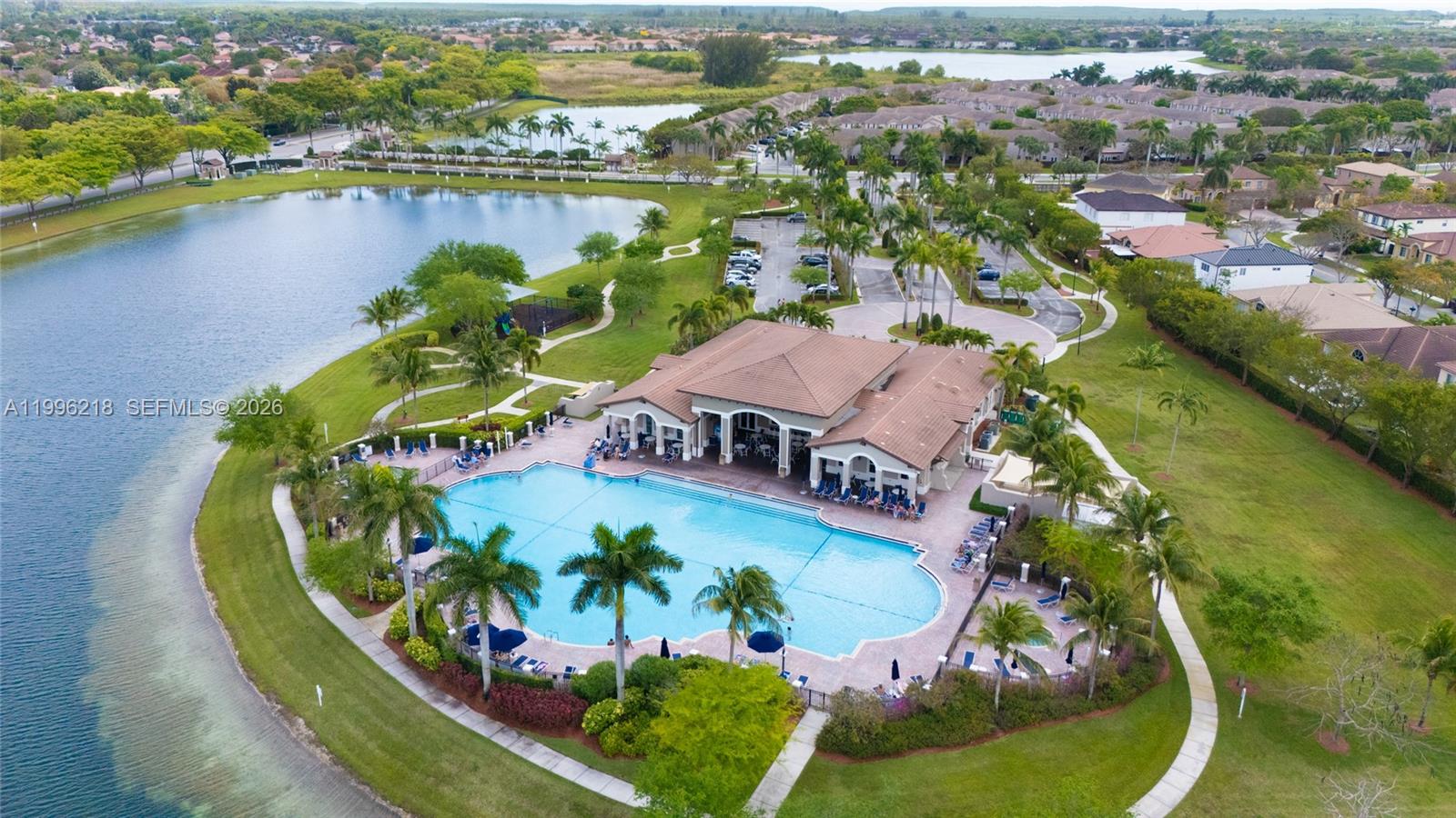 9041 Southwest 227th Street, Unit 5 Cutler Bay, FL 33190 - Photo 39 of 41 an aerial view of a house with a lake view