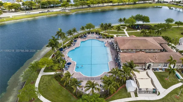 an aerial view of a house with a lake view