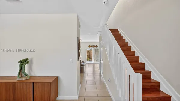 a view of a hallway with staircase