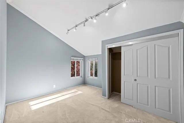 a view of a livingroom with an empty space and a window