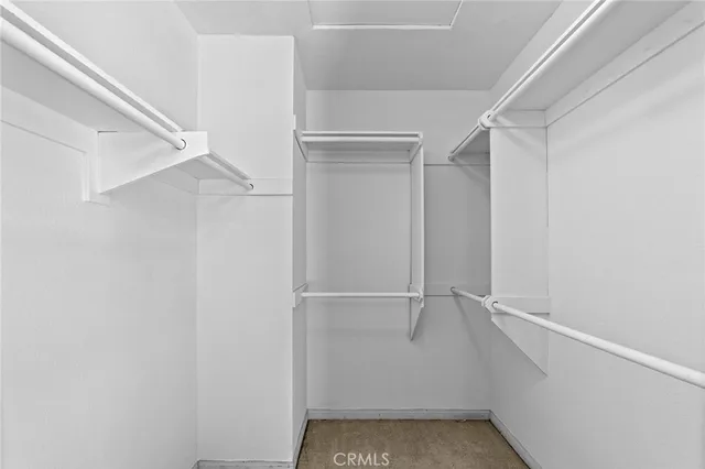 a view of an empty walk in closet