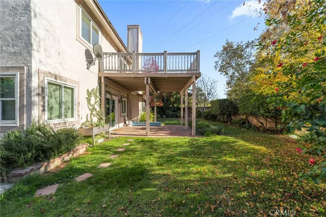 a view of a house with a yard and plants