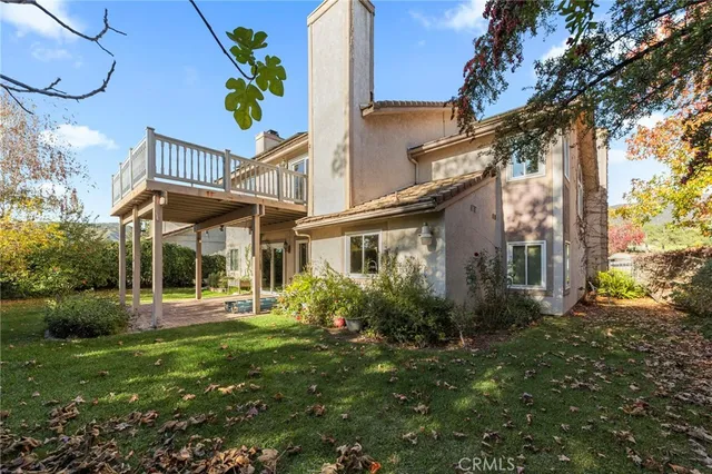 an aerial view of a house with a garden