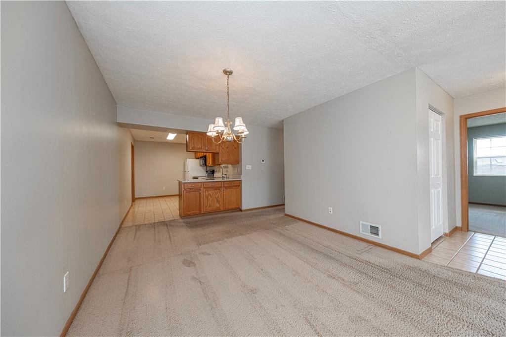 131 Pony Drive Freedom, PA 15042 - Photo 11 of 39 a view of a kitchen with a sink and dishwasher with wooden floor