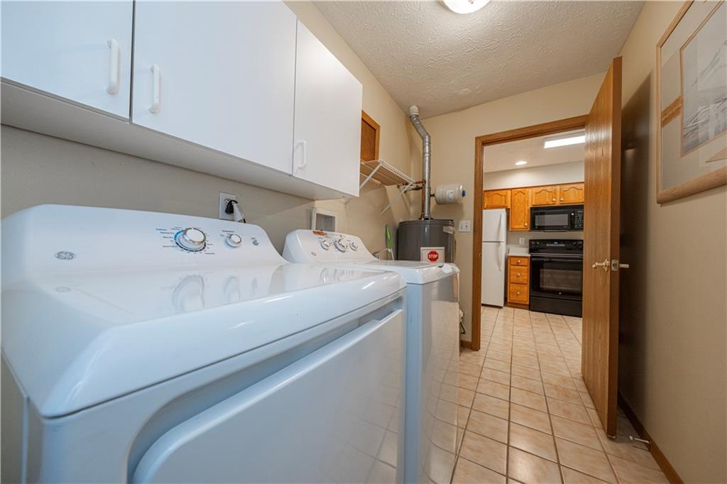 131 Pony Drive Freedom, PA 15042 - Photo 16 of 39 a utility room with dryer and washer