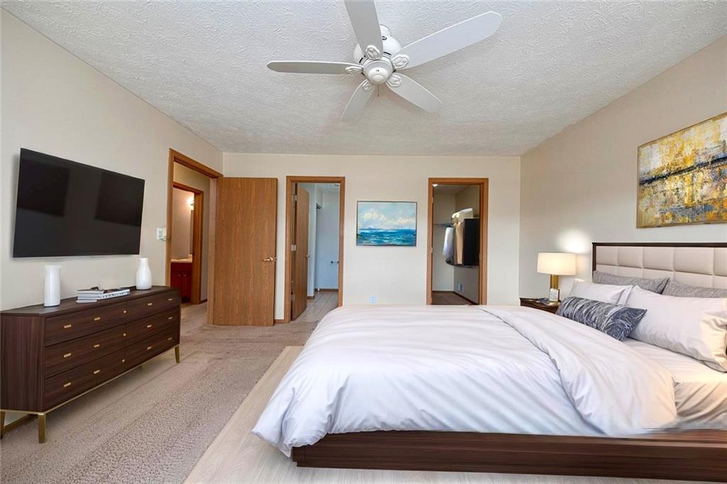 131 Pony Drive Freedom, PA 15042 - Photo 17 of 39 a bedroom with a bed and a flat screen tv