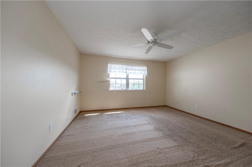 131 Pony Drive Freedom, PA 15042 - Photo 18 of 39 an empty room with windows and fan