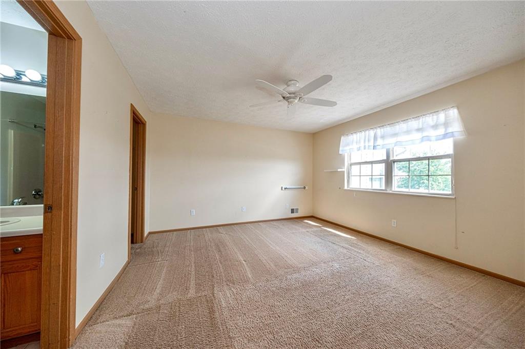 131 Pony Drive Freedom, PA 15042 - Photo 19 of 39 an empty room with a window and a hallway