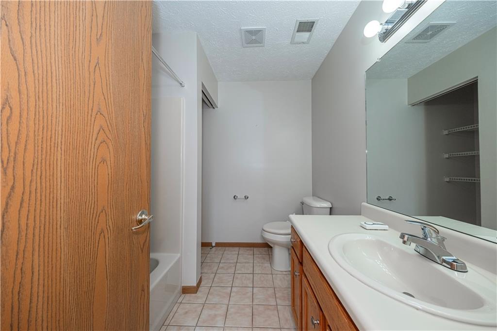 131 Pony Drive Freedom, PA 15042 - Photo 22 of 39 a bathroom with a sink and a mirror