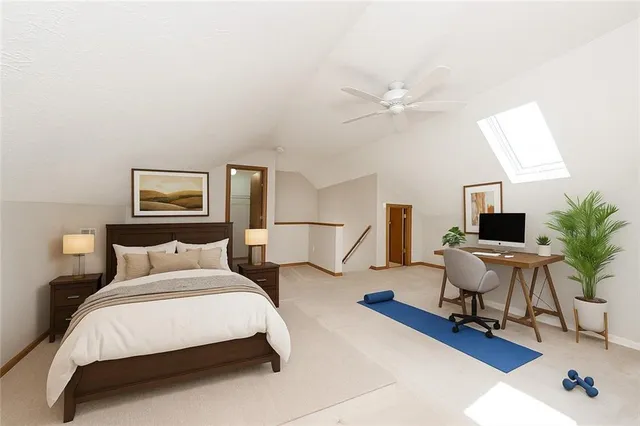 an empty room with closet and a ceiling fan