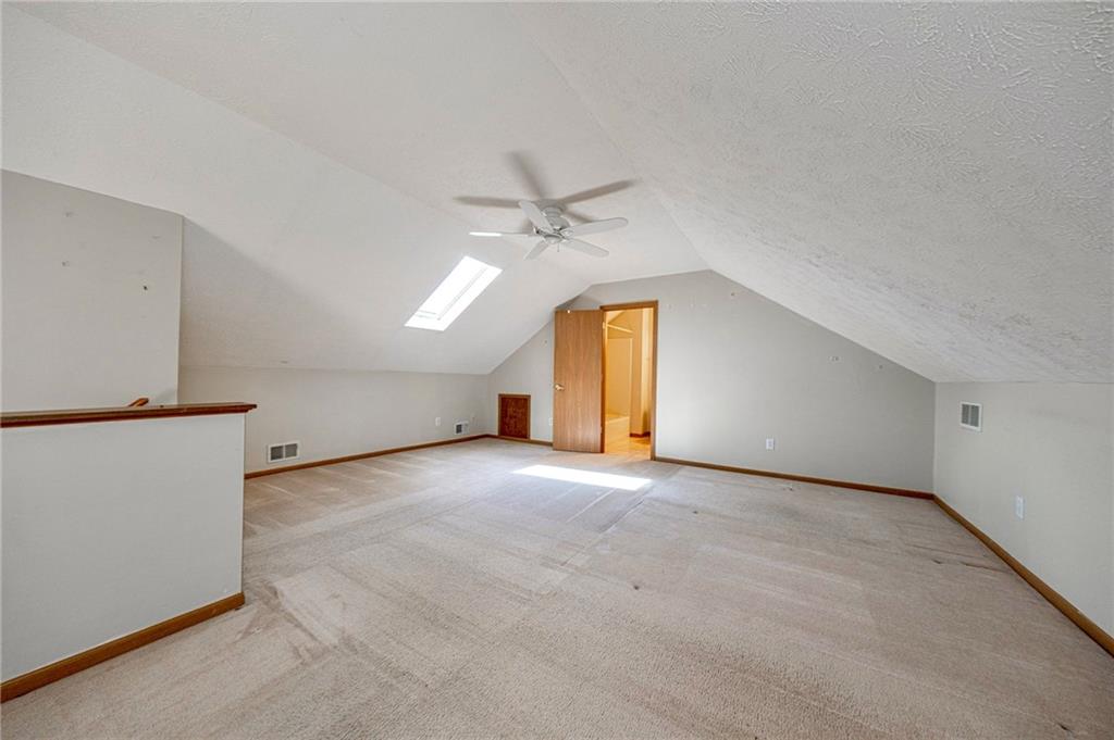 131 Pony Drive Freedom, PA 15042 - Photo 29 of 39 an empty room with a ceiling fan and window