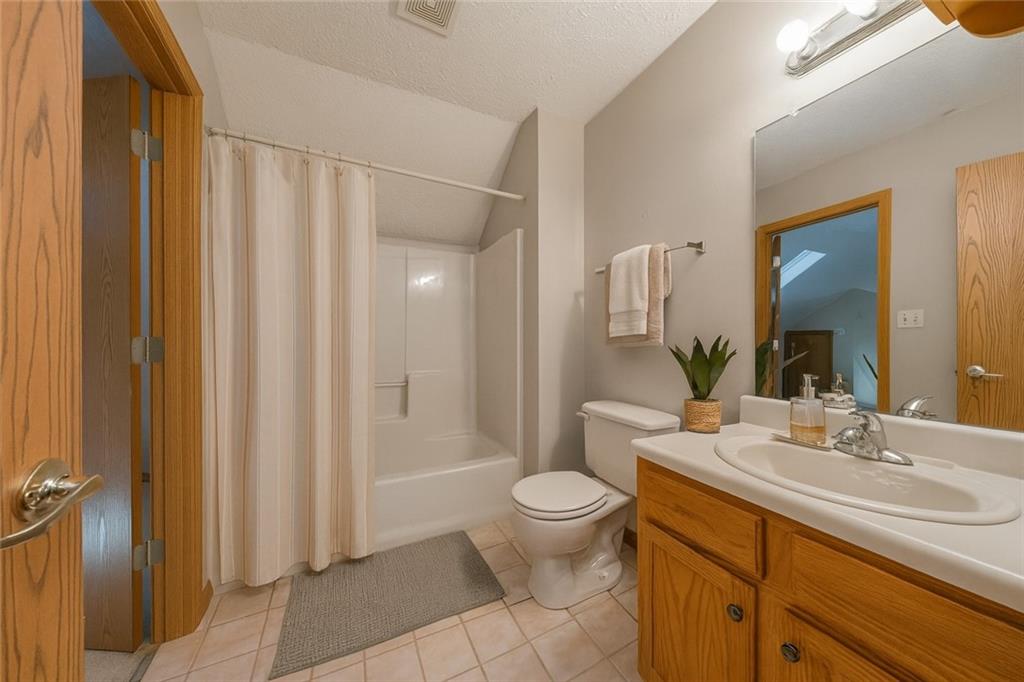 131 Pony Drive Freedom, PA 15042 - Photo 30 of 39 a bathroom with a sink a toilet and shower