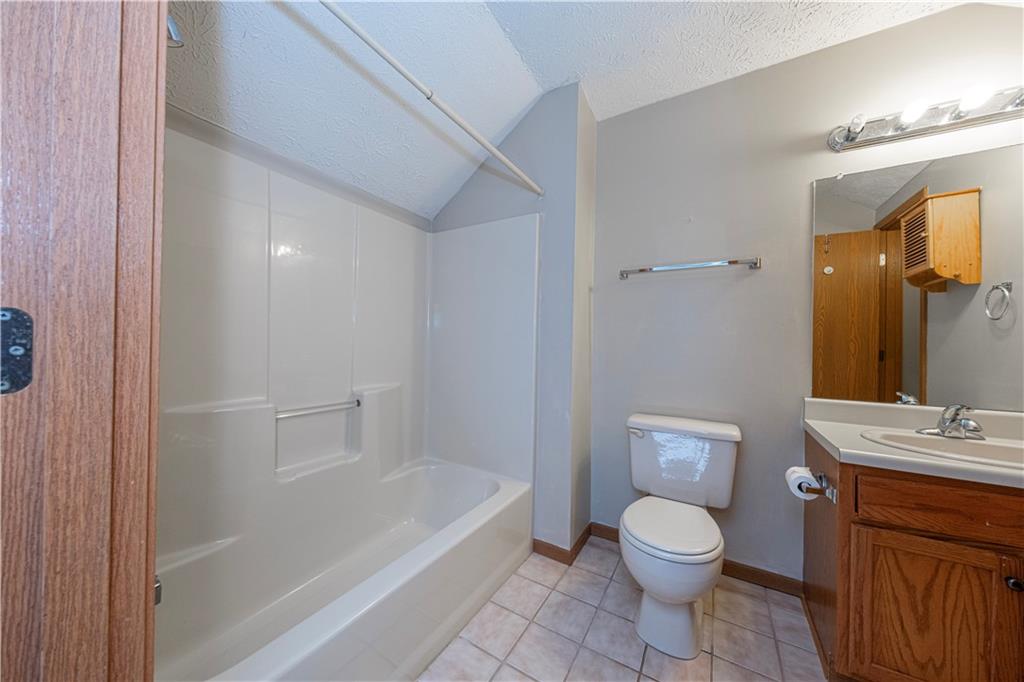 131 Pony Drive Freedom, PA 15042 - Photo 31 of 39 a bathroom with a toilet a sink and bathtub