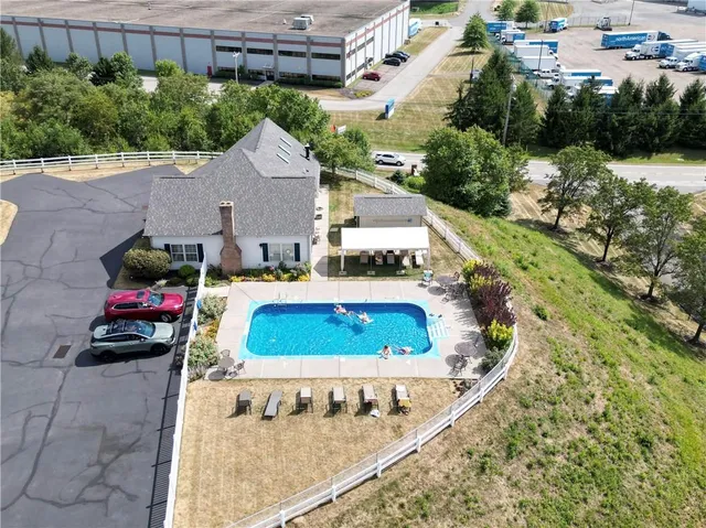 an aerial view of residential houses with outdoor space