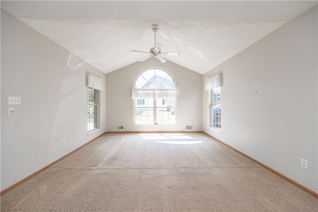 131 Pony Drive Freedom, PA 15042 - Photo 9 of 39 an empty room with windows and chandelier