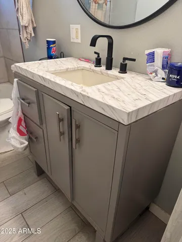 a bathroom with a sink and a mirror