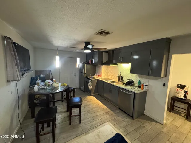 a kitchen with a sink and cabinets