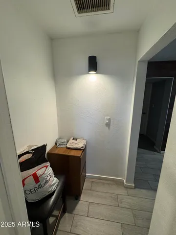 a room with furniture and wooden floor