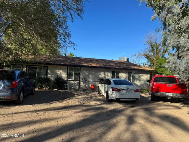 a view of car parked in front of garage