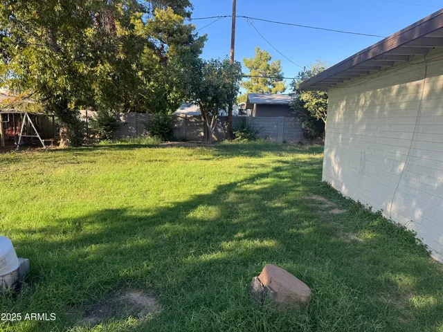 a backyard of a house with lots of green space