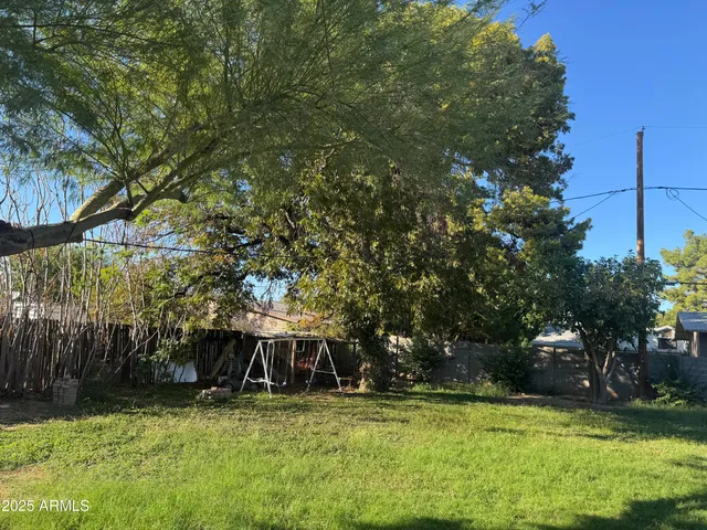 a view of a swimming pool with a yard