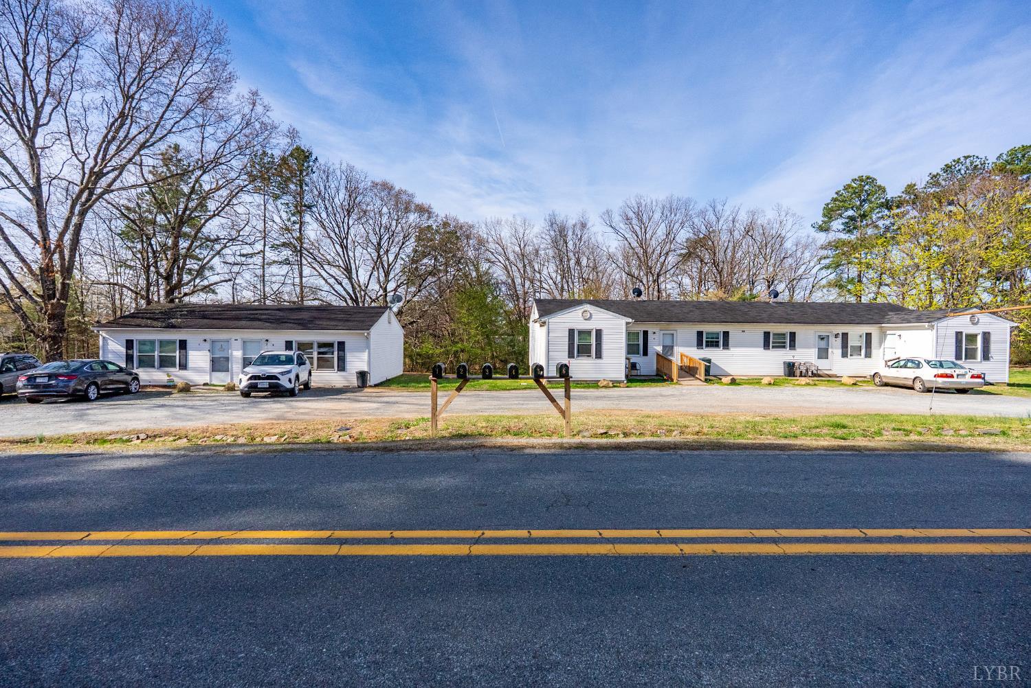 803 Henry Street Gretna, VA 24557 - Photo 1 of 15 a front view of a house with swimming pool and sitting area