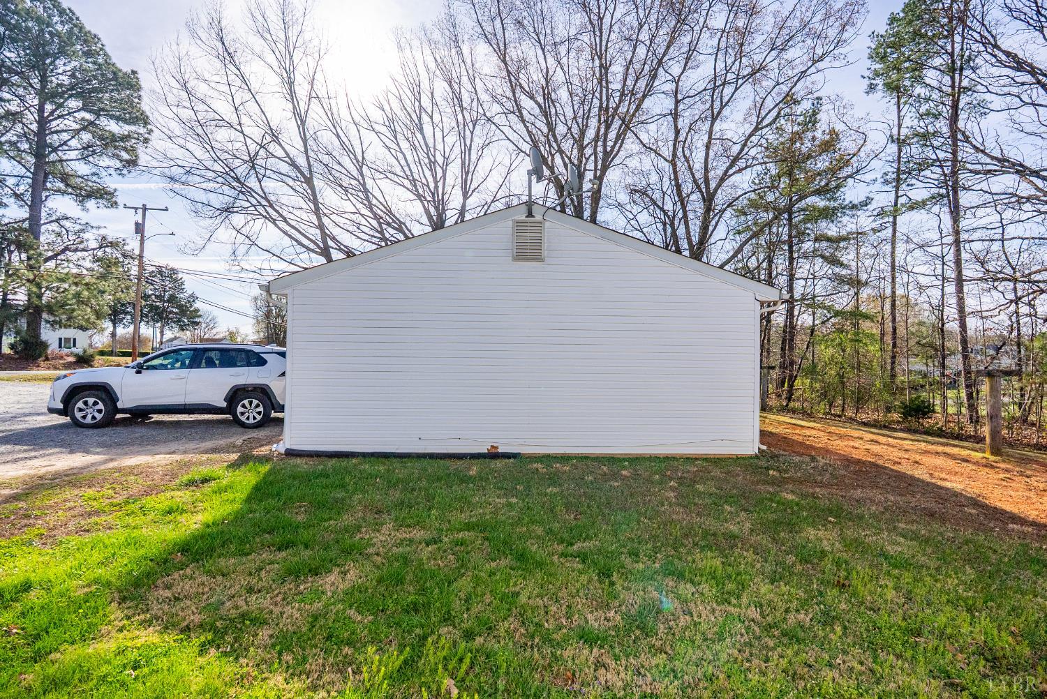 803 Henry Street Gretna, VA 24557 - Photo 13 of 15 a view of a backyard with a car park